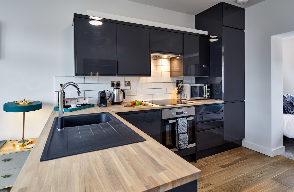 Fully equipped kitchen with Nespresso machine features in this Coppergate serviced property for business travellers