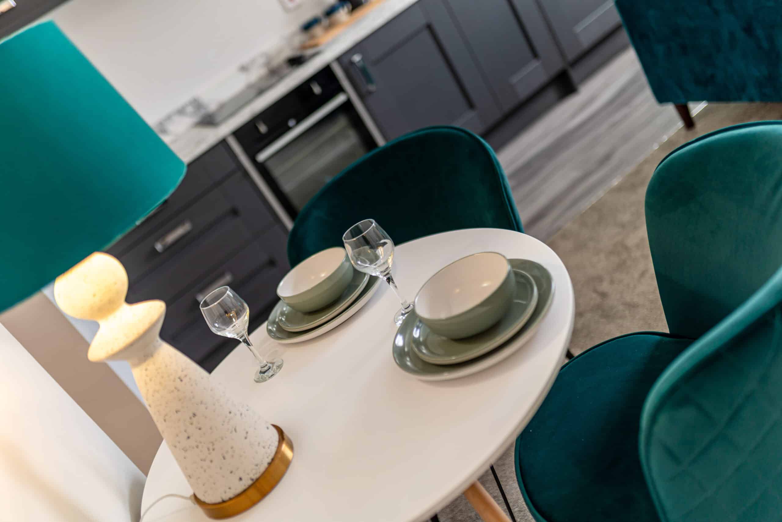 Dining table for up to 4 people with crockery, cutlery and glassware provided in this 2 bedroom apartment in Grimsby for corporate travellers